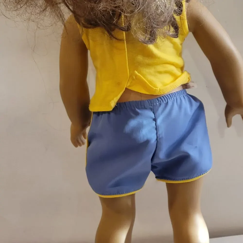American Girl Doll Grey eyes light brown hair.